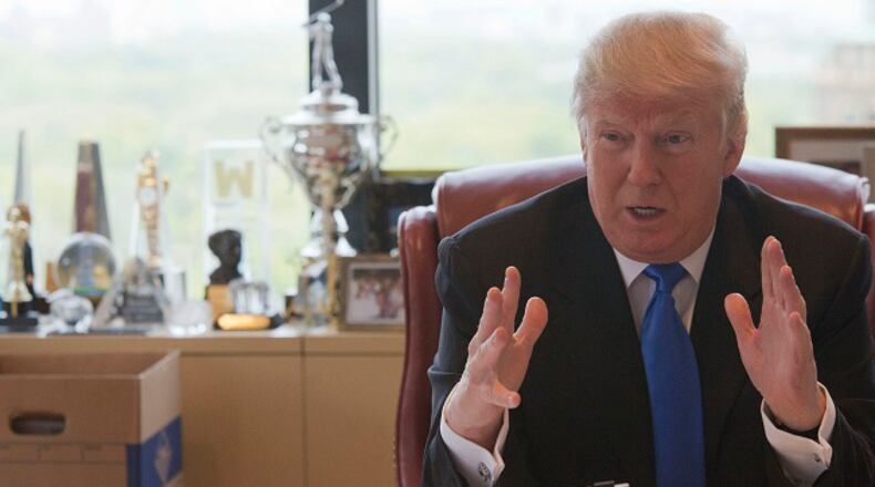 Republican presidential candidate Donald Trump gestures as he speaks during an interview with The Associated Press in his office at Trump Tower, Tuesday, May 10, 2016, in New York. (AP Photo/Mary Altaffer)