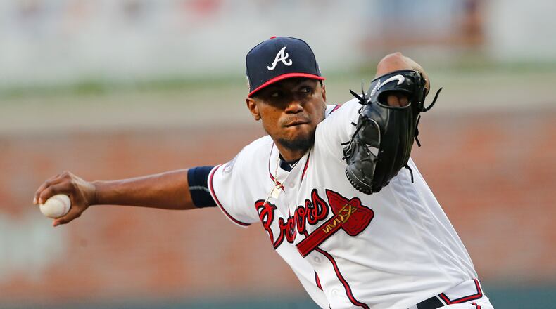 Braves starting pitcher Julio Teheran (49) works in the first inning of a baseball game against the Pittsburgh Pirates Wednesday, May 24, 2017, in Atlanta. (AP Photo/John Bazemore)