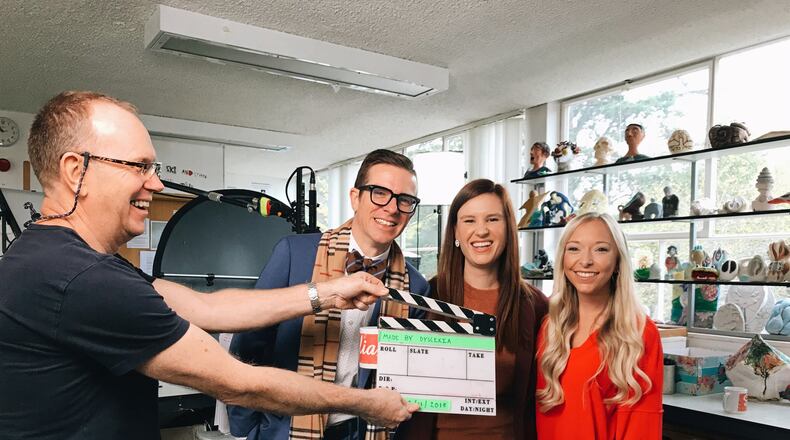 Staff from The Schenck School in Atlanta were highlighted in a series of videos that were made into an education program by Microsoft and Made by Dyslexia, a global nonprofit. A production assistant holds the slate clapper as Josh Clark, head of school, Hart Stuck, fifth grade teacher and Isoline Abels, second grade teacher prepare for a scene. COURTESY OF MICROSOFT