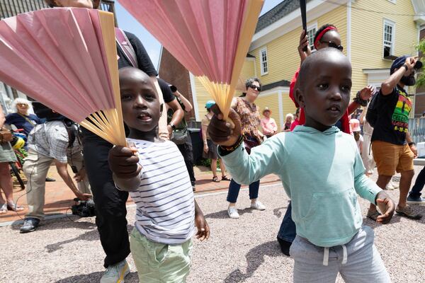 Levis Martin, left, and his brother Daniel dance during a Juneteenth celebration at the African Burying Ground Memorial Park Thursday, June 19, 2025, in Portsmouth, N.H. (AP Photo/Michael Dwyer)