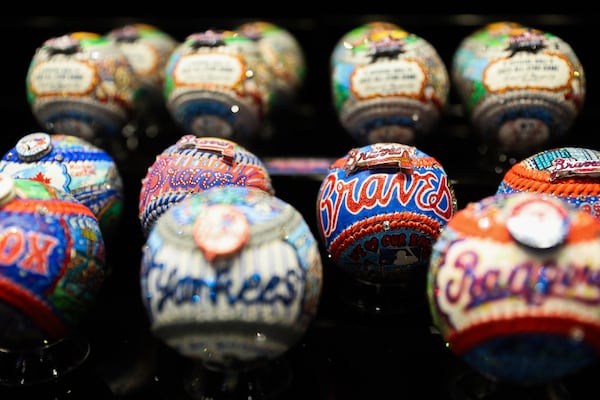 Charles Fazzino’s work, such as these hand-painted baseballs, will be on display at the Capitol One All-Star Village at Cobb Galleria until Tuesday. (Abbey Cutrer/AJC)