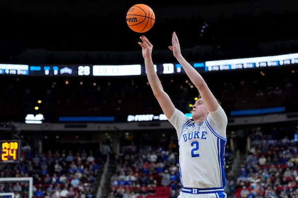 Duke forward Cooper Flagg (2) makes a three-point shot during the second half in the first round of the NCAA college basketball tournament against Mount St. Mary's, Friday, March 21, 2025, in Raleigh, N.C. (AP Photo/Stephanie Scarbrough)