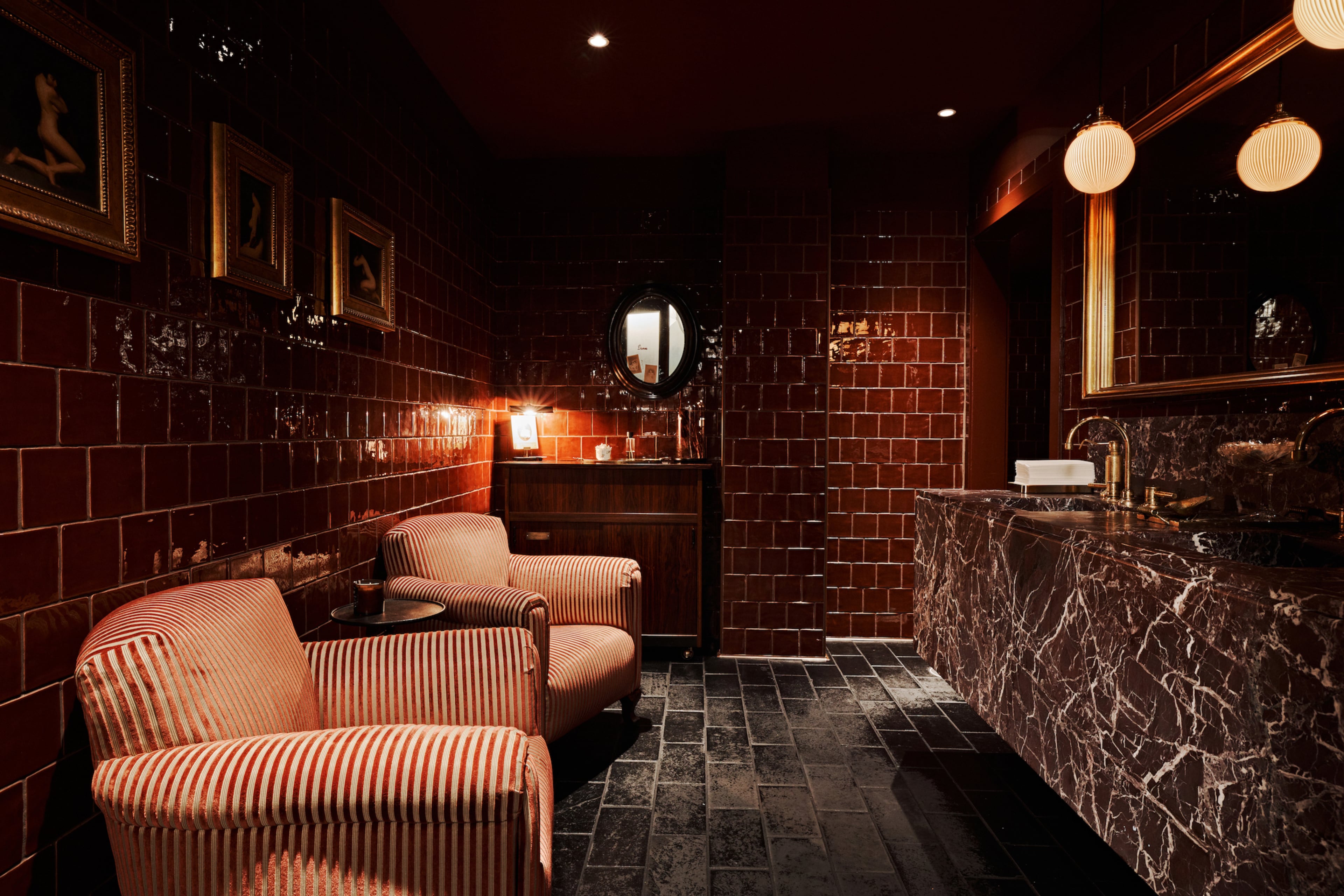The attention to design at Little Sparrow extends to a dark, moody restroom that encourages lingering. (Courtesy of Little Sparrow)