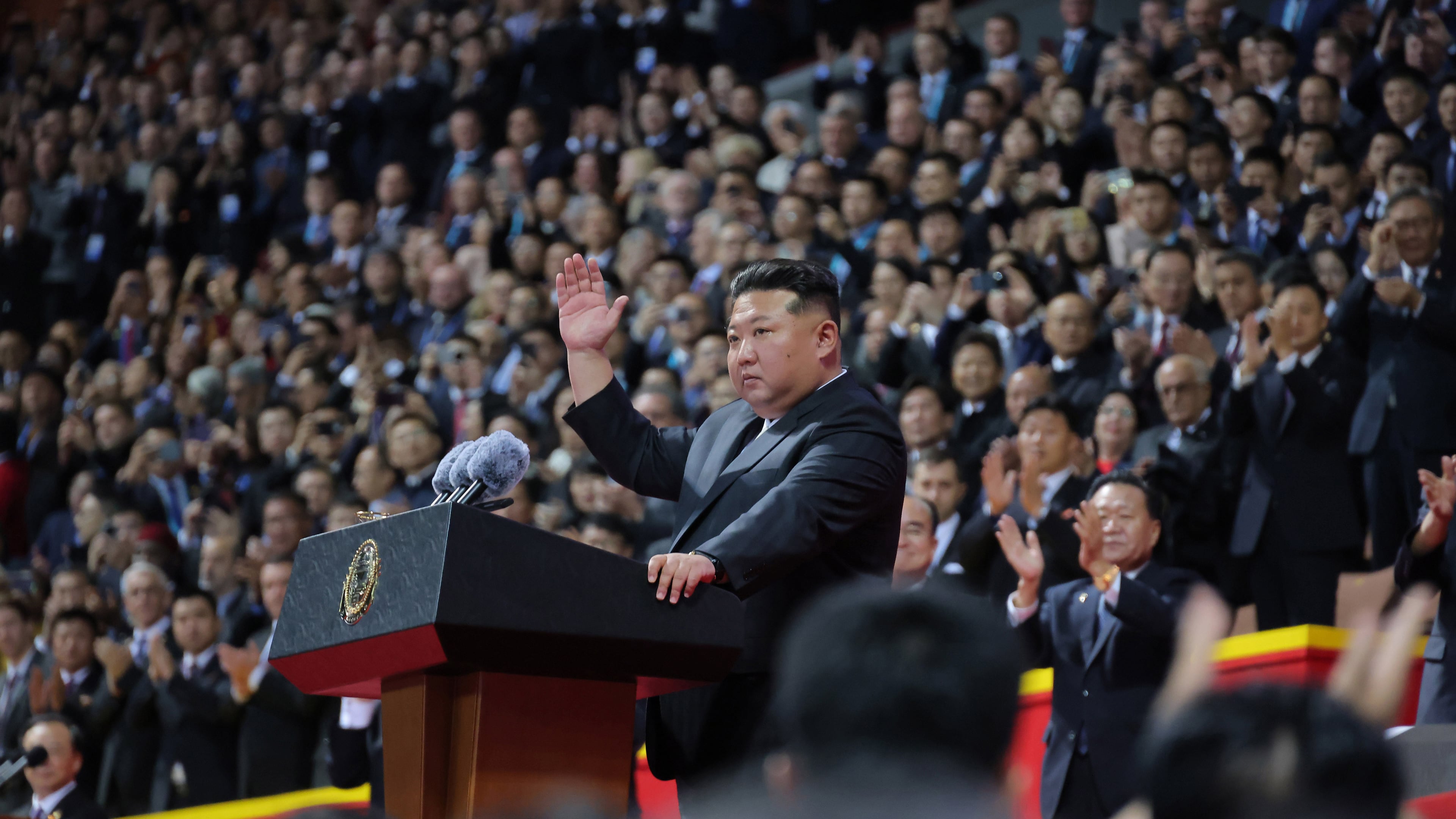In this photo provided by North Korean government, North Korean leader Kim Jong Un, center, waves during the ceremony marking the 80th anniversary of the ruling Workers’ Party, in Pyongyang, North Korea, Thursday, Oct. 9, 2025. Independent journalists were not given access to cover the event depicted in this image distributed by the North Korean government. The content of this image is as provided and cannot be independently verified. Korean language watermark on image as provided by source reads: "KCNA" which is the abbreviation for Korean Central News Agency. (Korean Central News Agency/Korea News Service via AP)