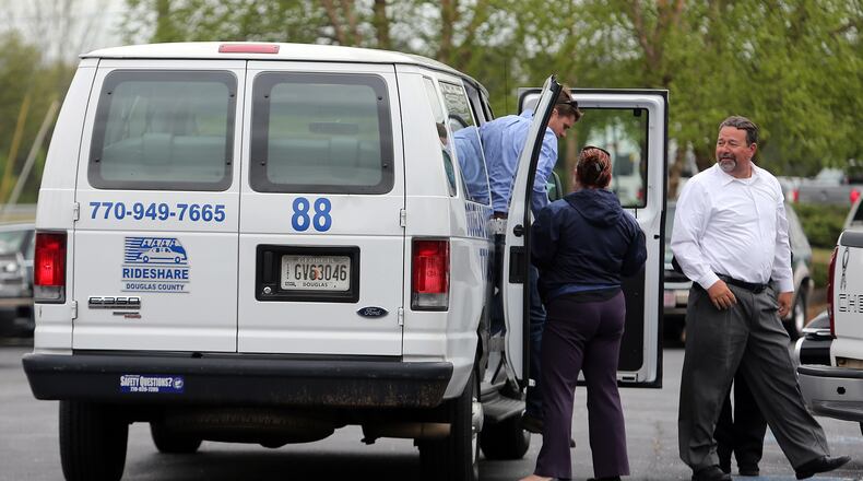 April 15, 2014 Douglasville: Rideshare vans were used to shuttle mourners to the visitation for Cpt. Herb Emory Tuesday afternoon April 15, 2014 in Douglasville. BEN GRAY / BGRAY@AJC.COM