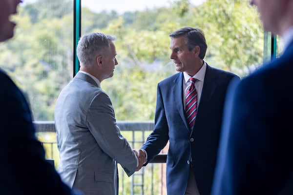 State Sen. John F. Kennedy (left), who is running for lieutenant governor, and Republican U.S. Senate candidate Derek Dooley shake hands at the Georgia Chamber Congressional Luncheon at the Columbus Convention and Trade Center on Wednesday, Aug. 20, 2025 in Columbus. (Arvin Temkar/AJC)