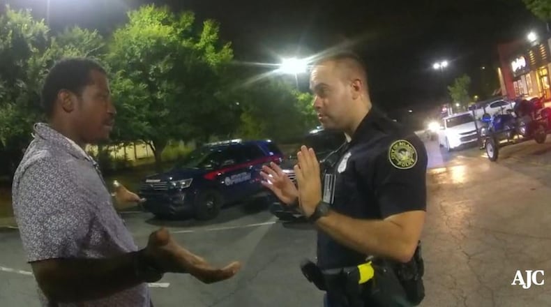 Rayshard Brooks talks with Atlanta Police Officer Garrett Rolfe in Wendy’s parking lot before Rolfe shoots him in the back, killing him. (Contributed)