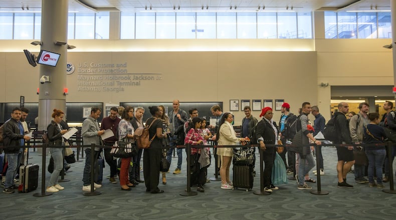 People wait in line at U.S. Customs and Border Protection at Hartsfield-Jackson Atlanta International Airport on May 2, 2018. ALYSSA POINTER/ALYSSA.POINTER@AJC.COM