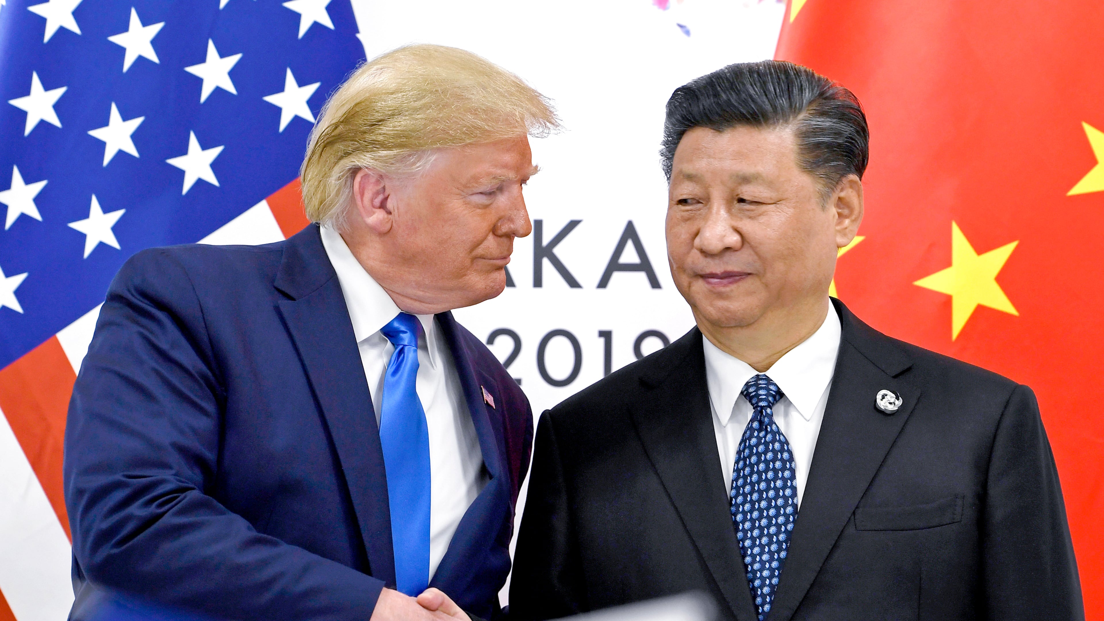 FILE - President Donald Trump, left, shakes hands with China's President Xi Jinping during a meeting on the sidelines of the G-20 summit in Osaka, Japan, June 29, 2019. (AP Photo/Susan Walsh, File)