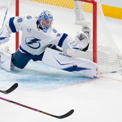 Tampa Bay Lightning goaltender Andrei Vasilevskiy (88) stops a shot by Montreal Canadiens' Ivan Demidov (93) during the second period of Game 6 in the first round of an NHL hockey Stanley Cup playoff series in Montreal, Friday, May 1, 2026. (Christinne Muschi/The Canadian Press via AP)