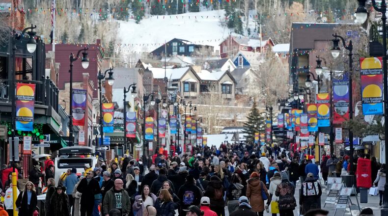 Pedestrians walk down Main Street on the first day of the 2026 Sundance Film Festival on Thursday, Jan. 22, 2026, in Park City, Utah. (Photo by Charles Sykes/Invision/AP)