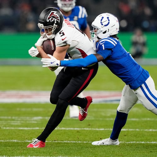 Atlanta Falcons wide receiver Drake London (5) is tackled by Indianapolis Colts cornerback Sauce Gardner (1) after catching a pass during the first half of an NFL football game, Sunday, Nov. 9, 2025, in Berlin, Germany. (AP Photo/Martin Meissner)