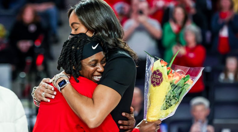 Georgia senior Que Morrison gives coach Joni Taylor a hug in Senior Day ceremonies earlier this year. The Dream signed Morrison to a training camp contract. (Photo by Tony Walsh/UGA Athletics)