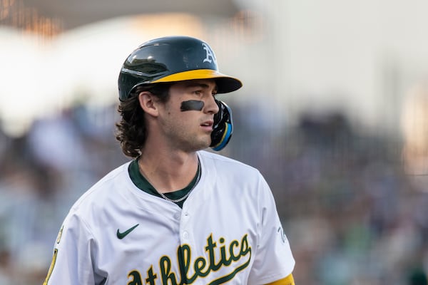 Athletics' Jacob Wilson watches the pitcher while on deck during the first inning of a baseball game against the Cleveland Guardians Friday, June 20, 2025, in West Sacramento, Calif. (AP Photo/Sara Nevis)