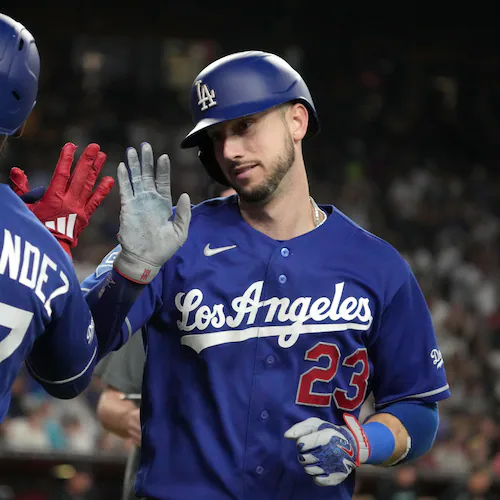 Los Angeles Dodgers' Kyle Tucker celebrates with Teoscar Hernández (37) after hitting a solo home run against the Arizona Diamondbacks in the eighth inning of a baseball game, Saturday, Aug. 8, 2026, in Phoenix. (AP Photo/Rick Scuteri)