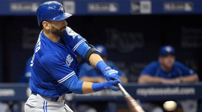 Toronto Blue Jays' Jose Bautista hits a two-run home run off Tampa Bay Rays starting pitcher Chris Archer during the third inning of a baseball game in St. Petersburg, Fla., Saturday, April 30, 2016. (AP Photo/Phelan M. Ebenhack)