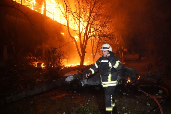 Firefighters tackle a blaze after a Russian attack that hit a residential building in Kharkiv, Ukraine, Wednesday, June 11, 2025. (AP Photo/Andrii Marienko)