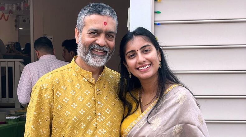This 2022 photo provided by Mukti Patel shows Umesh Kumar and his daughter, Akanksha, in Richmond, Va. (Mukti Patel via AP)