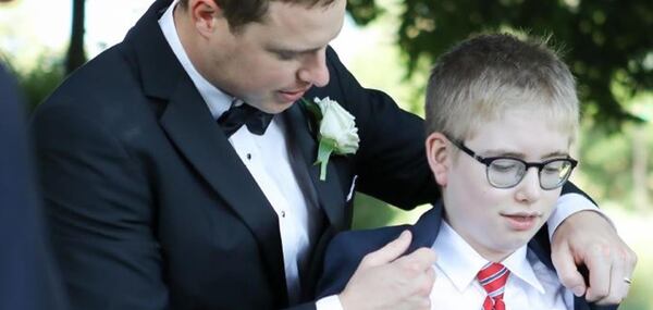 Nicholas Schulz (left) started a fundraising campaign to help students with autism after his younger brother Robby (right) died in a bike accident in Marietta.