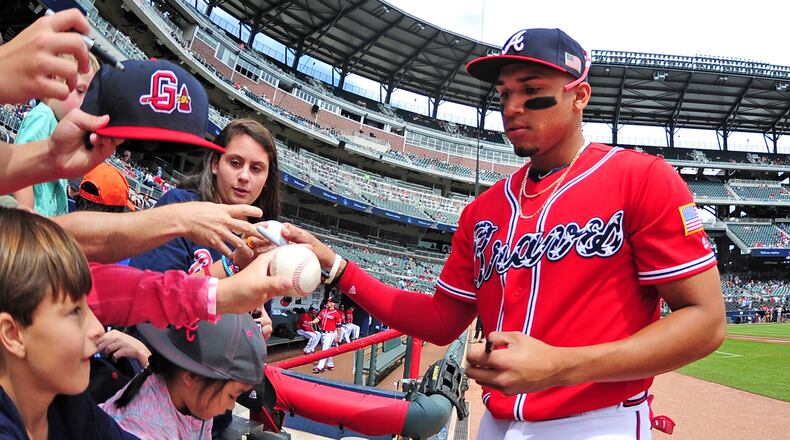 ATLANTA, GA - SEPTEMBER 10: Johan Camargo #17 of the Atlanta Braves signs autographs before the game against the Miami Marlins at SunTrust Park on September 10, 2017 in Atlanta, Georgia. (Photo by Scott Cunningham/Getty Images)