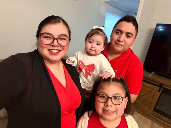 Heber Ovando and Bailey Espinoza with their two daughters.