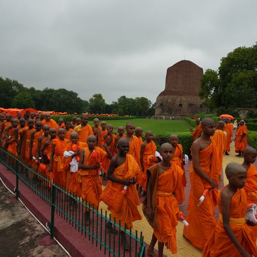 Novice monks walk in a procession near Dhamek Stupa in Sarnath, India, Sunday, July 19, 2026. (AP Photo/Rajesh Kumar Singh)