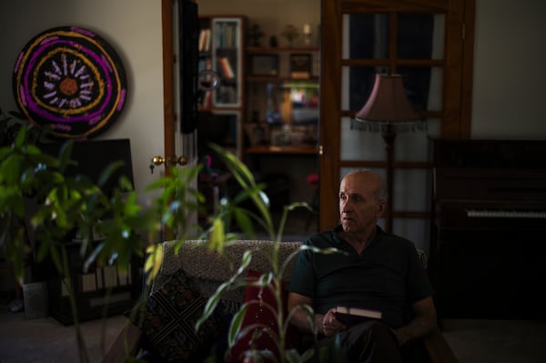 Kamran Afary, an associate professor of communication at California State University, Los Angeles, who immigrated from Iran in the 1970s, sits for a photo in the "Tehrangeles" neighborhood of Los Angeles Sunday, June 29, 2025. (AP Photo/Jae C. Hong)
