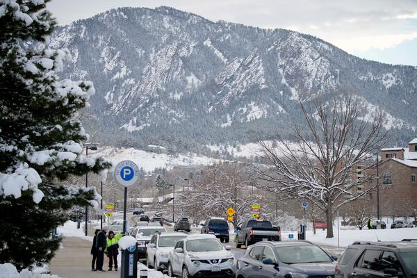 FILE - Snow coats the intermountain West, the Flatirons, on Feb. 12, 2022, in Boulder, Colo. (AP Photo/David Zalubowski, File)