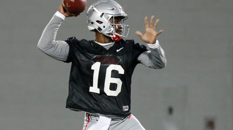 FILE - In this March 7, 2017, file photo, Ohio State quarterback J.T. Barrett runs a drill during an NCAA college football practice  in Columbus, Ohio. In many conferences, the Penn State would be predicted to repeat as Big Ten champions. Not in the Big Ten East, where Ohio State is loaded with as much talent as ever and motivated to atone for an embarrassing finish to 2016. (AP Photo/Jay LaPrete)