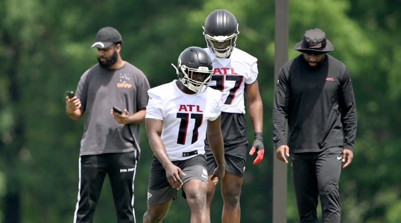 Atlanta Falcons edge rushers Jalon Walker (11) and James Pearce Jr. (27) run a drill during the Atlanta Falcons Rookie Minicamp at the Atlanta Falcons Training Camp, Friday, May 9, 2025, in Flowery Branch. (Hyosub Shin / AJC)