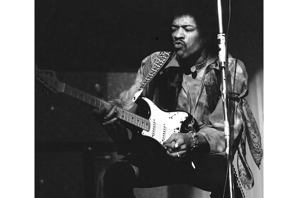 FILE - Jimi Hendrix performs on tour at the Rheinhalle in Dusseldorf, Germany on Jan. 14, 1969. (AP Photo/Hinninger, File)