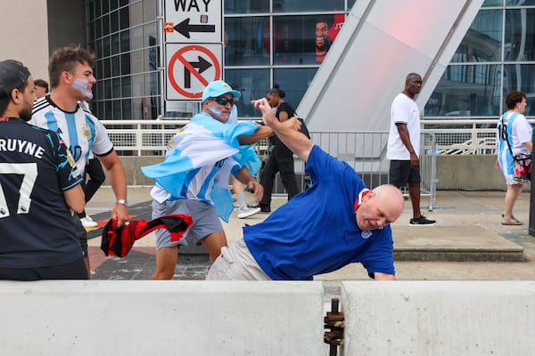 An Argentina fan punches an England fan after Argentina wins the FIFA World Cup game between England and Argentina in Atlanta on July 15, 2026. It’s the last game Atlanta is hosting. Argentina won 2-1. (Arvin Temkar/AJC)