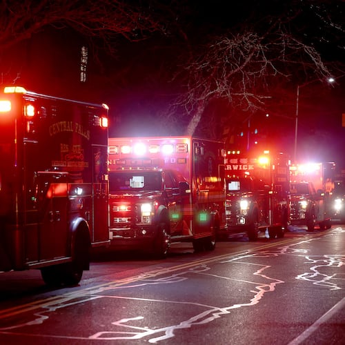 Ambulances line Hope Street at Brown University in Providence, R.I., Saturday, Dec. 13, 2025, during reports of a shooting. (AP Photo/Mark Stockwell)