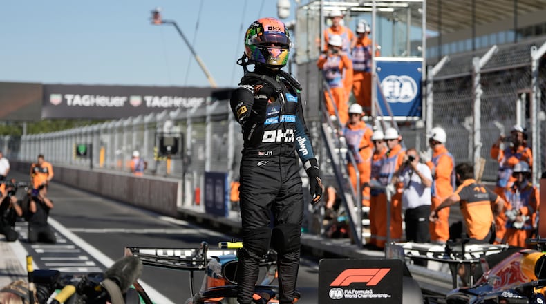 McLaren driver Lando Norris of Britain celebrates his pole position after the qualifying session for the Spanish Formula One Grand Prix in Madrid, Saturday, Sept. 12, 2026. (AP Photo/Bernat Armangue)