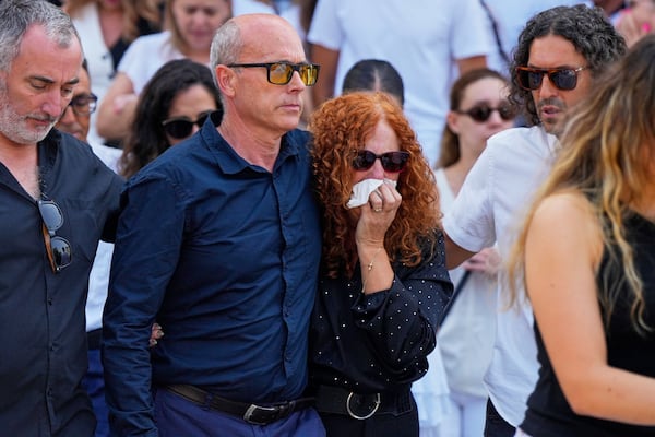 Diogo Jota's parents Joaquim and Isabel, reacts next to the coffin of their sons, during their funeral in Gondomar, near Porto, Portugal, on Saturday, July 5, 2025. (AP Photo/Manu Fernandez)