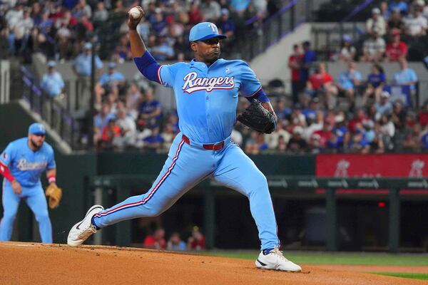 Texas Rangers starting pitcher Kumar Rocker throws during the first inning of a baseball game against the Chicago White Sox, Sunday, June 15, 2025, in Arlington, Texas. (AP Photo/LM Otero)