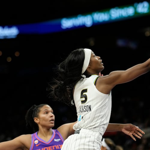 Chicago Sky forward Rickea Jackson (5) drives past Phoenix Mercury forward Alyssa Thomas to score during the second half of a WNBA basketball game, Friday, May 15, 2026, in Phoenix. (AP Photo/Ross D. Franklin)