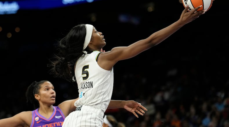 Chicago Sky forward Rickea Jackson (5) drives past Phoenix Mercury forward Alyssa Thomas to score during the second half of a WNBA basketball game, Friday, May 15, 2026, in Phoenix. (AP Photo/Ross D. Franklin)