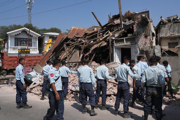 Myanmar's military personnel search through rubble of a collapsed building following Friday's earthquake in Naypyitaw, Myanmar, Tuesday, April 1, 2025. (AP Photo)