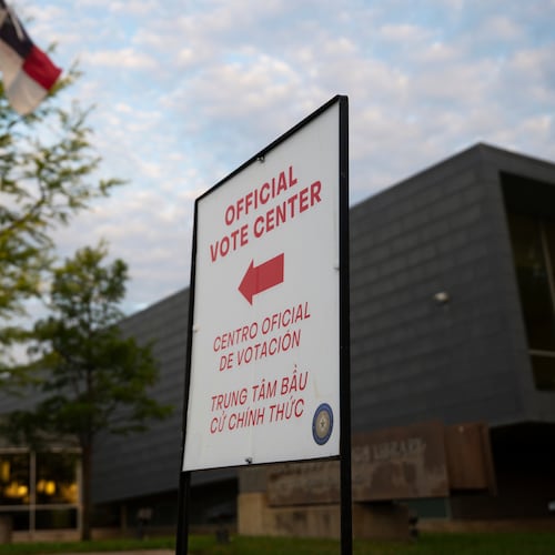FILE - An official voting center sign stands outside of a polling location on May 26, 2026, in Dallas. (AP Photo/Gabriela Passos, File)
