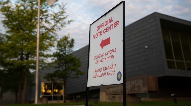 FILE - An official voting center sign stands outside of a polling location on May 26, 2026, in Dallas. (AP Photo/Gabriela Passos, File)