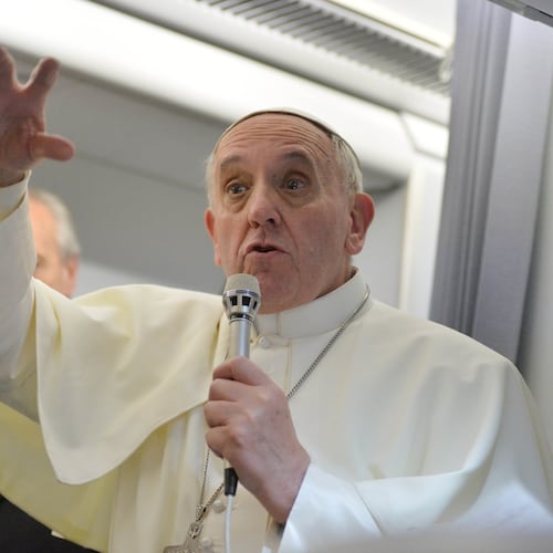 FILE - Pope Francis answers reporters questions during a news conference aboard the papal flight on its way back from Brazil, Monday, July 29, 2013. (AP Photo/Luca Zennaro, Pool, File)