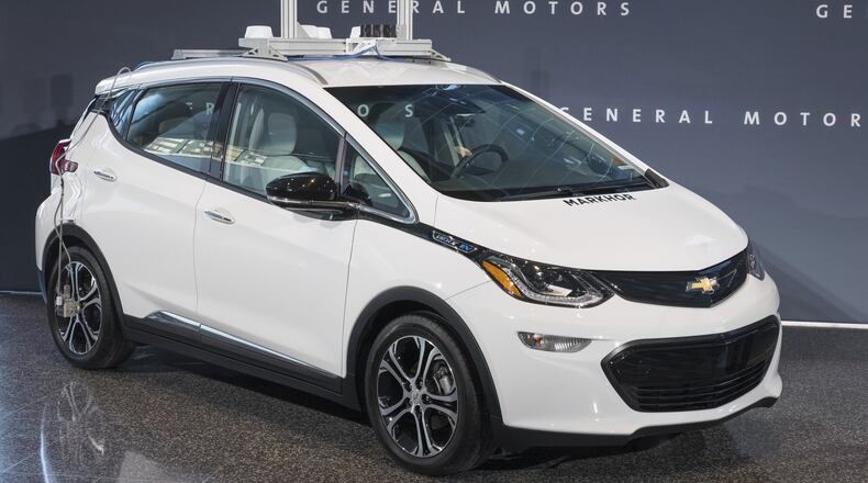 In this photo provided by General Motors a self-driving car is seen in Detroit. GM is trying to persuade state lawmakers across the country to pass legislation that would clear the way for the automaker to make self-driving cars publicly available while potentially barring GM’s competitors from putting their own vehicles on the road. (Photo by Steve Fecht for General Motors)