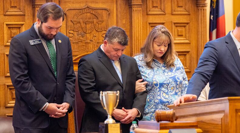 Laken Riley's father, Jason Riley, second from left, and her stepmother, Amanda Riley, appeared Wednesday before the state Senate. Jason Riley called on Gov. Brian Kemp to “please declare an invasion to detain and deport criminal illegals" to avoid tragedies like the one that struck his family when Laken Riley was killed. A Venezuelan national who authorities say entered the country illegally has been charged in the 22-year-old nursing student's death. (Arvin Temkar / arvin.temkar@ajc.com)