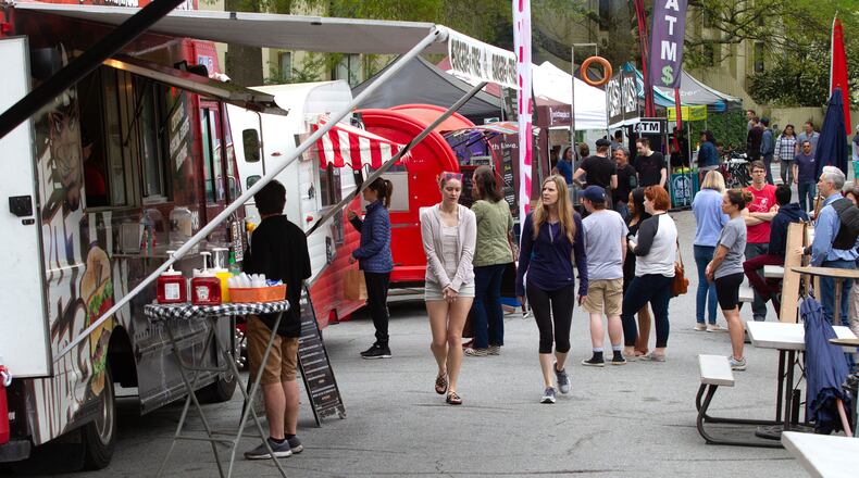 Visitors look over the food truck options during The Festival on Ponce in Atlanta in 2019. STEVE SCHAEFER / SPECIAL TO THE AJC
