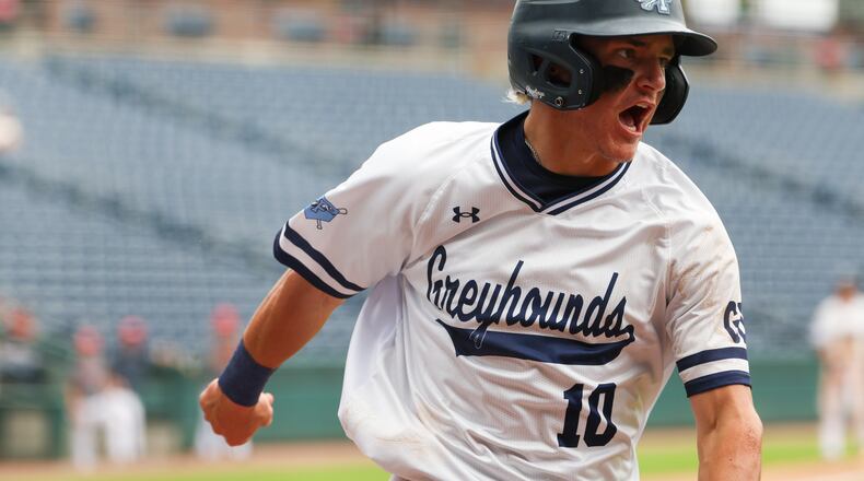Pope’s Parker Troughton scores in the fourth inning of Game 2 against Loganville in the GHSA Class 5A baseball championship series at Gwinnett Field in Lawrenceville on May 26, 2026. Pope won the game, but ultimately not the series. (Arvin Temkar/AJC)