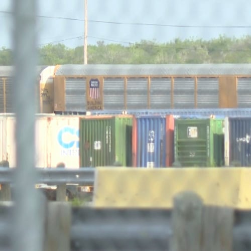 In this image taken from video footage provided by KGNS, Union Pacific train cars are stationed at a rail yard in Laredo, Texas, Sunday, May 10, 2026. (KGNS via AP)