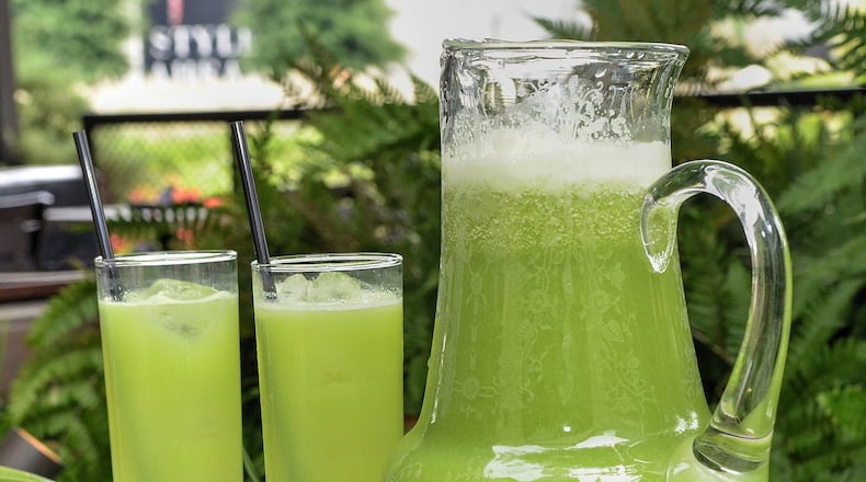 Clarke Anderson, a beverage director for Atlanta restaurateur Ford Fry, created his Green Ghost cocktail for the Attack of the Killer Tomato Festival in July. Made with fresh green tomato, celery, cucumber, lemon and lime juices, plus salted simple syrup salt, the gin-based Green Ghost calls for a splash of absinthe, which adds a milky quality and whiff of anise. (Styling by Clarke Anderson; photo by Chris Hunt/Special)