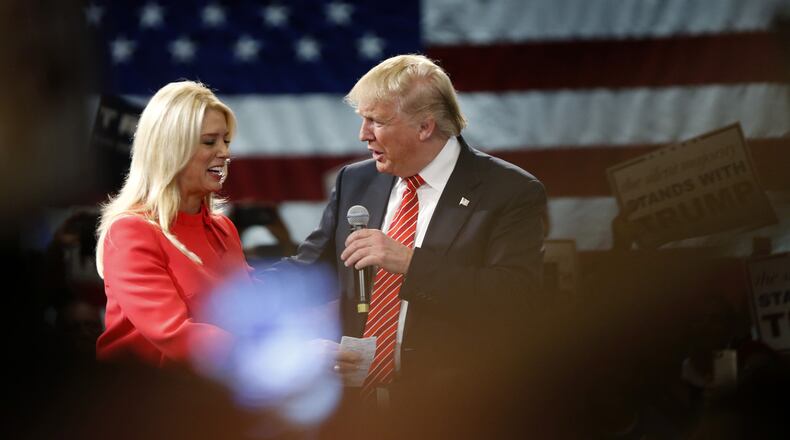 Florida Attorney General Pam Bondi appears at a rally with Donald Trump. (AP)