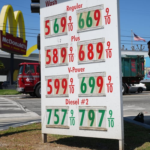 Gas prices are displayed at a gasoline station, Tuesday, April 7, 2026, in Los Angeles. (AP Photo/Damian Dovarganes)